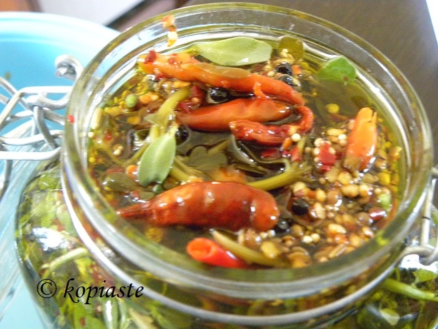 jar with pickled purslane and spices